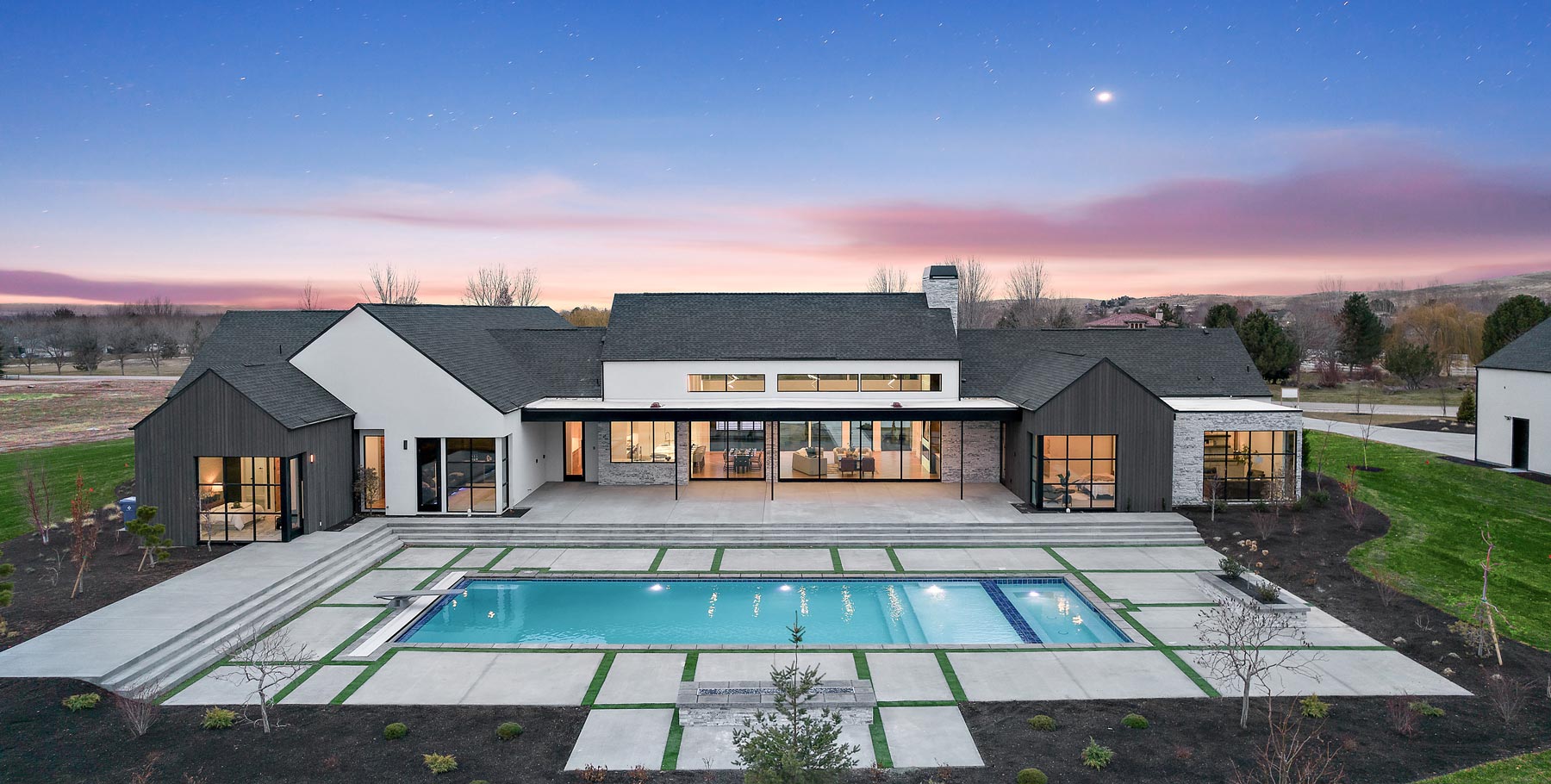 modern home with an in-ground pool